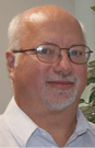 Roger Brauninger Headshot With Plant Background Fmt
