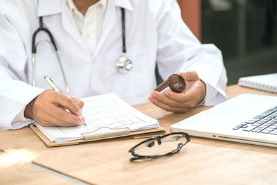 Doctor Writing Prescription 2 Dreamstime Credit Boonchai Wedmakawand Resized