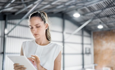 I Stock 641999426 Woman Digital Tablet Warehouse Fmt