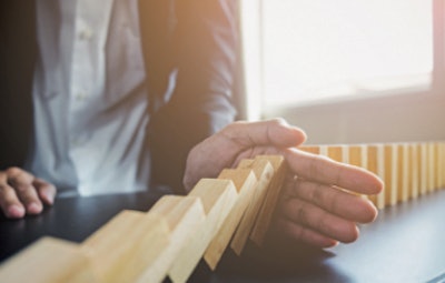 I Stock 692261242 Hand Stops Falling Blocks Fmt