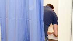Man In Voting Booth Resized