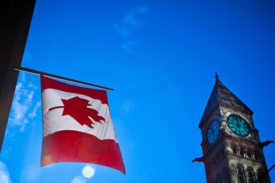 Canada Flag And Building Dreamstime Credit Aqnus Febriyant Resized