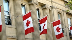 Canadian Flags On Building Dreamstime Credit Saphire Ovadia Resized