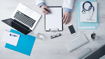 Doctor Writing On Table Dreamstime Credit Stokkete Resized