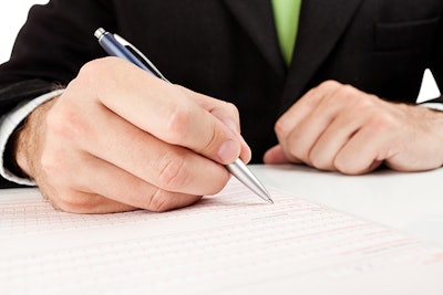 Filling Out Form Dreamstime Credit Ellobo1 Resized
