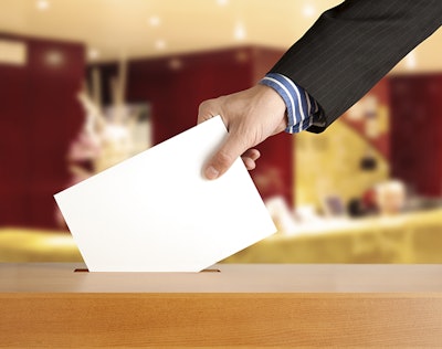 Hand Placing Vote In Box Dreamstime Credit Andrey Burmakin Resized