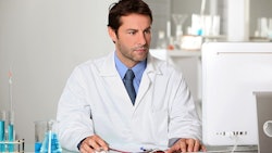 Lab Tech On Computer Dreamstime Credit Auremar Resized