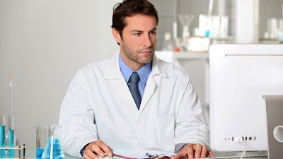 Lab Tech On Computer Dreamstime Credit Auremar Resized