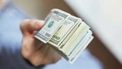 Money In Hand Adobe Stock Credit Photoniko Resized