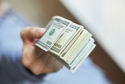 Money In Hand Adobe Stock Credit Photoniko Resized
