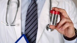 Doctor Holding Medical Marijuana Adobe Stock Credit Megaflopp Resized