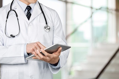 Doctor With I Pad Adobe Stock Credit Billion Photos Com Resized