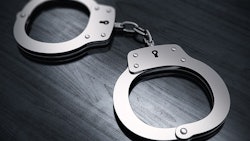 Handcuffs On Table Adobe Stock Credit Scanrail Resized