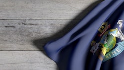 Main Flag On Table Adobe Stock Credit Erllre Resized