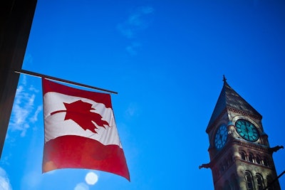 Canada Flag And Building Dreamstime Credit Aqnus Febriyant Resized