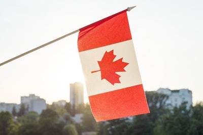 Canada Flag City Background Adobe Stock Credit Valerii Honcharuk Resized