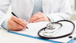Doctor With Clipboard Adobe Stock Credit Stasique Resized