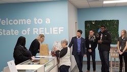 Joan Caleodis made the first purchase at CY+ Dispensary in Wintersville.