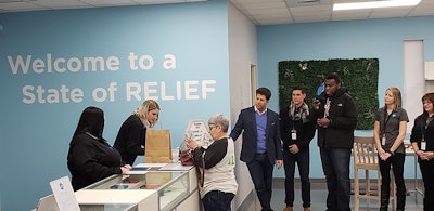 Joan Caleodis made the first purchase at CY+ Dispensary in Wintersville.