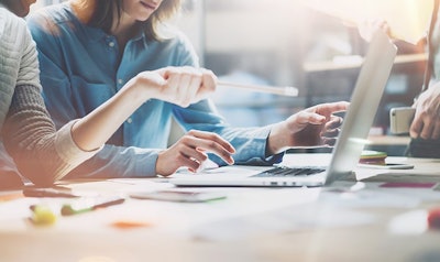 Coworkers Office Laptop Marketing Adobe Stock Credit Sfio Cracho Resized