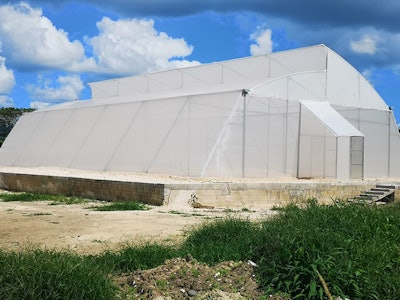 Gsn Cultivation Property Greenhouse Viewed From Main Gate Resized