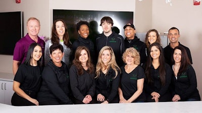 Greenhouse Wellness co-founders Gina Dubbé, bottom row, second from left; Dr. Leslie Apgar, top row, second from left; with some of their team