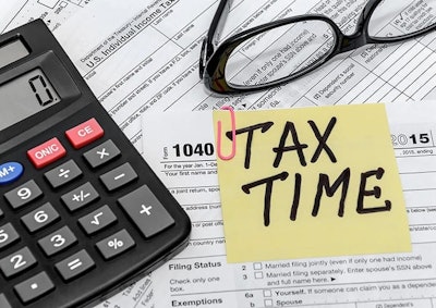 Tax Formwith Calculatorand Glasses Adobe Stock Credit Igorkolter Resized