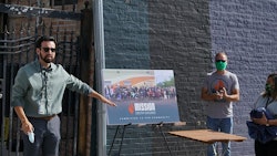 Mission Dispensary hosted a grand reopening celebration for its South Chicago store July 31. Gabe Mendoza, left, VP of operations, Kris Krane, middle, president and founder of Mission parent company 4Front Ventures, and Rebecca Gonzalez, right, store manager, recognize people involved in the cleanup after the South Chicago store was looted in May.