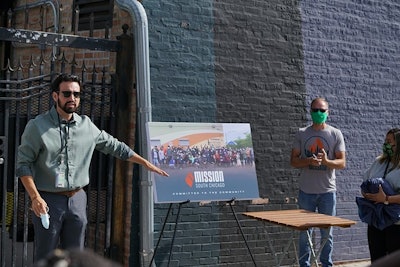Mission Dispensary hosted a grand reopening celebration for its South Chicago store July 31. Gabe Mendoza, left, VP of operations, Kris Krane, middle, president and founder of Mission parent company 4Front Ventures, and Rebecca Gonzalez, right, store manager, recognize people involved in the cleanup after the South Chicago store was looted in May.
