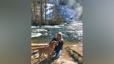 Melanie Ropp and her 11-year-old Labrador retriever, to whom Ropp administers CBD.