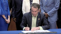 Virginia Gov. Ralph Northam signs adult-use cannabis legislation into law on Wednesday.