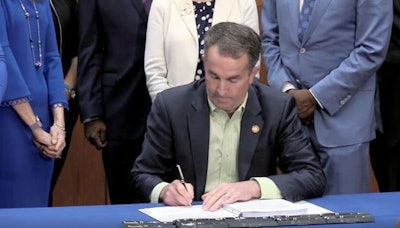 Virginia Gov. Ralph Northam signs adult-use cannabis legislation into law on Wednesday.