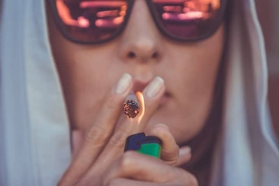 Young Woman Smoking Cannabis736x491
