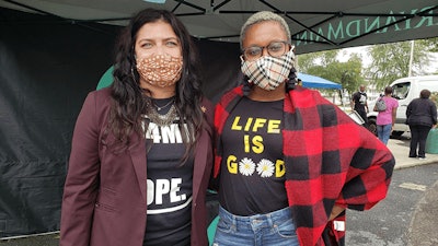 Dr. Paloma Lehfeldt, MD and Director of Medical Education at Vireo Health (left), poses with an attendee at an expungement clinic the company participated in at Maryland's Mary & Main dispensary last year.