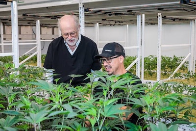 David Holmes, CEO and founder of Clade9, with Mel Frank, famed cannabis author and photographer, in Clade9's Los Angeles cultivation facility.