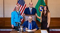 L-R: EAP Program Manager Annette Hoffman, ECY Legislative Coordinator Ken Camp, and WSDA Program Manager Trecia Ehrlich pose with Gov. Jay Inslee (front).