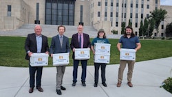 Representatives of New Economic Frontier delivering signatures on July 8.