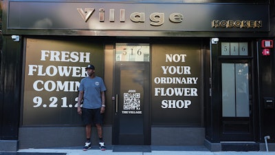 Al Harrington standing in front of Village dispensary in Hoboken, N.J.