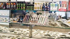Hemp CBD products in a display case, including tinctures, oils and plant.