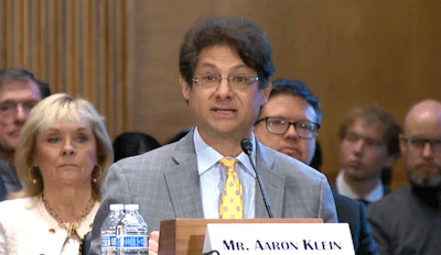 Aaron Klein, a senior fellow in economic studies at the Brookings Institution, testifies as a witness during the U.S. Senate Banking Committee's hearing on debanking on Feb. 5.