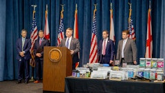 Alabama State Bureau of Investigation Major Crimes Chief Shawn Loughridge (center) talks about a multiagency operation that executed a series of warrants and seizures on June 23 at 10 CBD stores and vape shops in five cities.