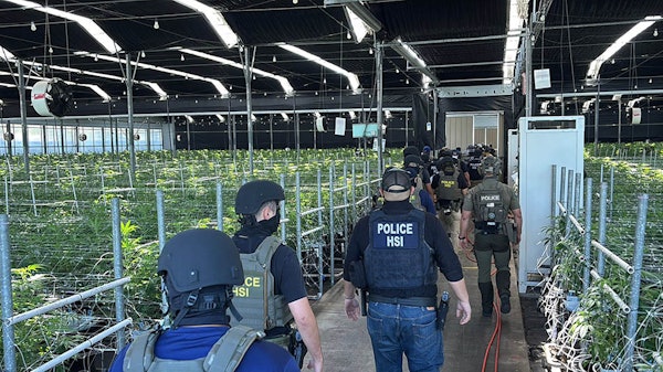 Federal agents execute warranted operations on July 10 at one of Glass House Farms' cannabis cultivation facilities in southern California.