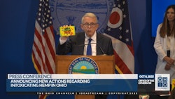 Ohio Gov. Mike DeWine shows how intoxicating hemp products can sometimes be packaged in manners similar to popular candies and snacks that entice children during an Oct. 8 press conference in Columbus.