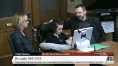 Nora Lowe (middle), a 17-year-old with Rett syndrome, testifies in support of a medical cannabis bill on Oct. 22 during the Wisconsin Senate Committee on Health hearing. She's joined by her parents, Megan and Josh.