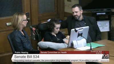Nora Lowe (middle), a 17-year-old with Rett syndrome, testifies in support of a medical cannabis bill on Oct. 22 during the Wisconsin Senate Committee on Health hearing. She's joined by her parents, Megan and Josh.
