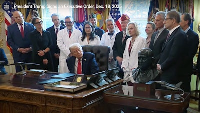 President Donald Trump signs an executive order Dec. 18, 2025, to reclassify cannabis to Schedule III.