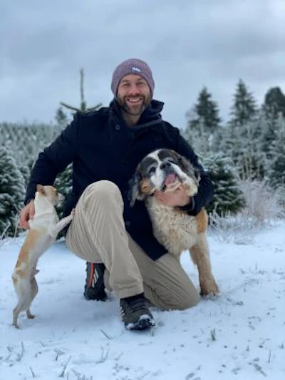 Lee Asher with Lillie and another dog at The Asher House animal sanctuary.