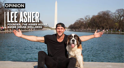 Lee Asher with his Saint Bernard, Lillie, whose seizures stopped after being treated with CBD.