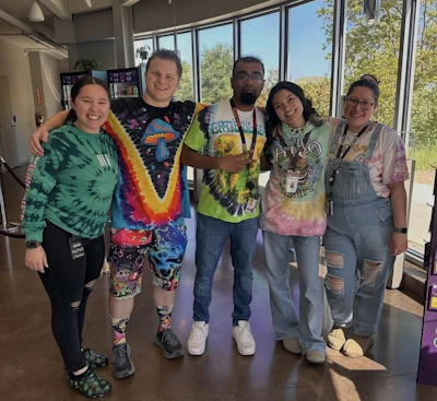 Velvet's Martinez team members on “tie-dye day' during Spirit Week, which the company holds annually.