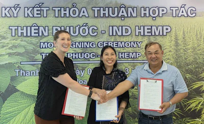 IND HEMP CEO Morgan Tweet, Thien Phuoc Owner Ms Thuy, and Summit International Trade owner Thanh HU celebrate the signing of a memorandum of understanding, outlining a farm-to-fashion hemp fiber textile supply chain collaboration with U.S.-grown hemp fiber supplying the Vietnamese textile industry.